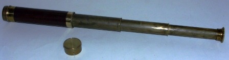 Late 19th century hand-held refracting telescope, maker unknown. With three brass draws and mahogany bound tube. 