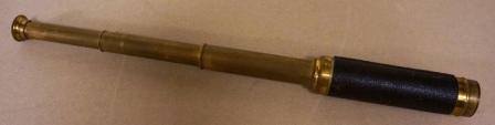 Late 19th century hand-held refracting telescope, maker unknown. With three brass draws and leather bound tube. 