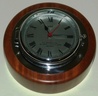 Mid 20th century SESTREL ships clock. Sold by C.L. Malmsjo & Co Ur, Optisk & Nautisk affär, Gothenburg Sweden. Battery-operated, mounted on wooden base. 