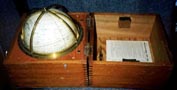 20th century Hughes & Son star globe mounted within brass meridians and stowed in original mahogany case.