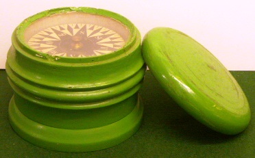 Early 19th century dry card compass mounted in painted wooden bowl, complete with woden lid.