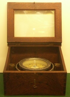 20th century naval compass from the "Kaiserliche Marine" dated 1916. Made by Carl Bamberg, Berlin-Friedenau. Mounted and set inside gimbals in a mahogany case with observation window and marked with the German Swastika. 