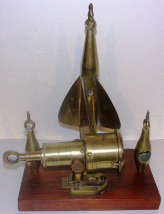 Early 20th century Cherub Mark II ship log in solid brass, made by Walker’s. Mounted on wooden panel. 