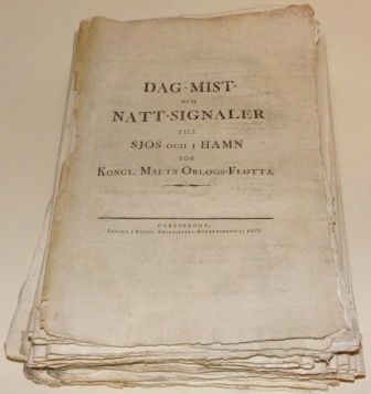 "Dag Mist och Natt Signaler till Sjös och i Hamn för Kongl. Maj:ts Örlogs-Flotta. Tryckt i Kongl. Amiralitets-Boktryckeriet, 1807 (Carlskrona)". Decree and instructions for day and night signals. For the Royal Swedish Navy, printed in 1807.