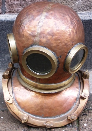 Early 20th century 12 bolt/three-light copper diving helmet. Manufacturer unknown.