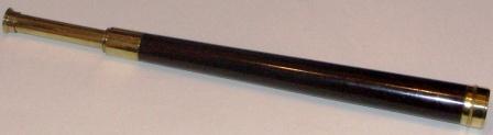 19th century hand-held refracting telescope. Maker unknown. One draw, brass, mahogany dressed.