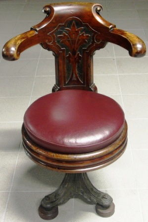 Swivel-chair in mahogany with cast-metal base. Leather seat. Late 19th century.