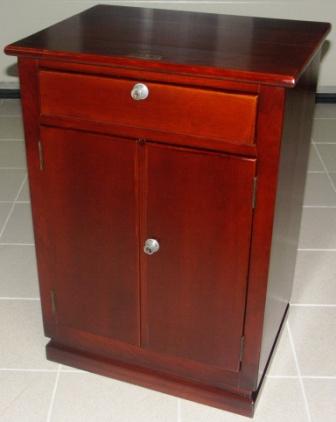 Cabinet in dark stained oak from the pantry onboard the cargo vessel M/S Atlantik. One drawer with three compartments inside and double door with shelf inside. 