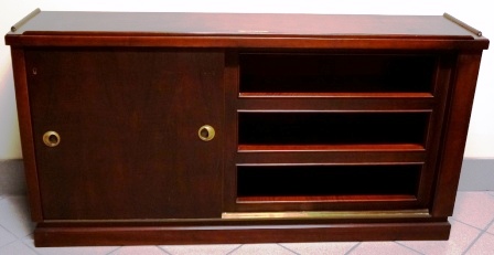 Sideboard in mahogany with brass fittings from M/S Bärenstein-Bremen, Norddeutscher Lloyd. One sliding door, three compartments and two shelves. 