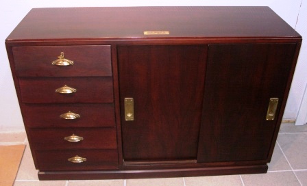 Sideboard in mahogany with brass fittings from M/S Hohenfels "Hansa" Bremen. Five drawers, two sliding doors with one shelf inside. 