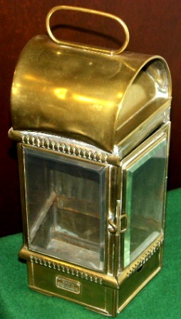 Early 20th century bulkhead light in brass with bevelled glass. Kerosene burner missing. Made by Eli Griffiths & Sons, Birmingham.