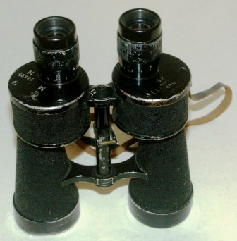 WWII German Navy "Kriegsmarine" binocular. Marked with the Swastika symbol, M (Marine), N28495 beh & 364866 (T) KF. 7x50. Black lacquered metal. 